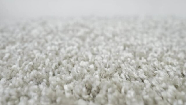 close-up of shaggy silver carpet camera movement.
