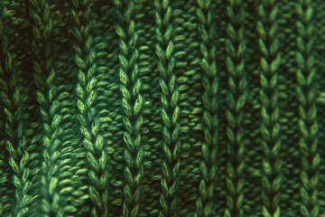 Beautiful knitted bright green fabric as background. Copy space. Needlework as background