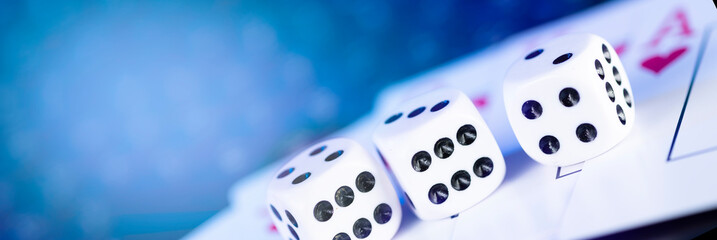 Online gaming platform, casino and gambling business. Cards, dice on laptop keyboard