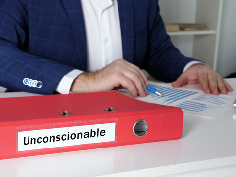  Financial concept about Unconscionable with inscription on the dossier