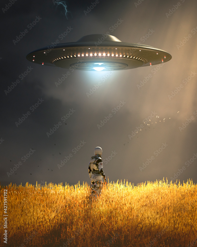 Wall mural ufo floating on a wheat field with an astronaut watching it on sunray in a cloudly day of summer - c