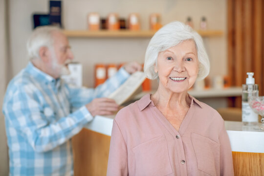 Gray-haired woman in a spa center with her husband