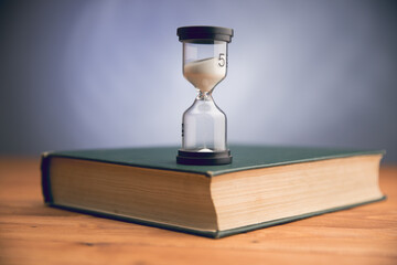 hourglass on the book
