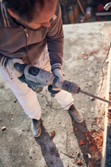 Real construction worker working on a house renovation - authentic person on the job.