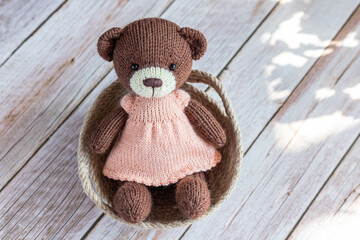 Soft toy bear in the basket.