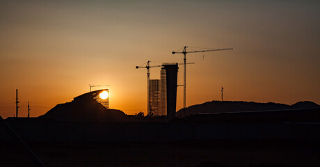 Construction of modern high-rise ski-jump in Shchuchinsk city, Kazakhstan. Silhouette of tower and...
