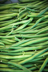 Beautiful full frame shot of a crate of green beans on sale in an italian organic food market. Healthy farmer's market produce on display.