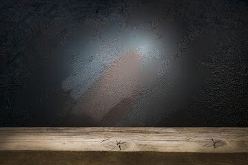 Selected focus empty brown wooden table and wall texture or old black brick wall blur background...