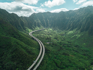 Aerial view of Oahu highway between the mountain of Hawaii. Road to Heaven.
