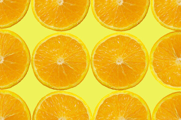 Orange Fruit slice on yellow Background. Healthy food lifestile. Food background. Applicable for fruit juice advertising. Frame, border. Copy space for text. Summer concept.