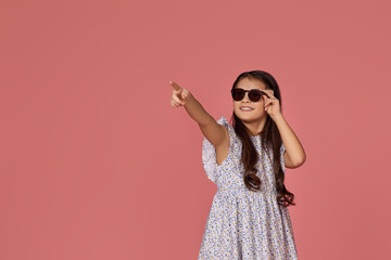 little child girl in summer dress and sunglasses