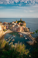 Vernazza - One of five cities in Cinque Terre, Italy. Colorful houses stacked upon each other along a cliffside in Italy.
