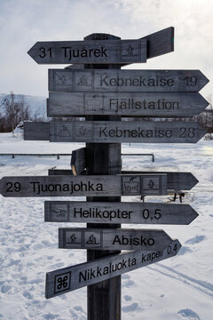 Nikkaluokta, Sweden Wooden signs at an outpost in the Arctic landscape showing places of interest.
