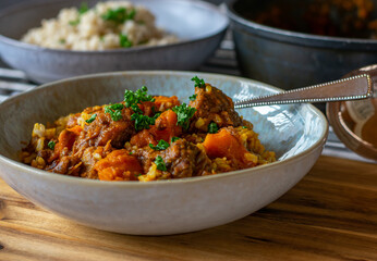 Delicious beef stew with brown rice and carrots