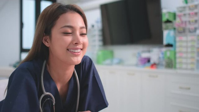 Beautiful doctor is smiling in beauty clinic and also look to right side. Concept of good environment support medical staff get happiness working.