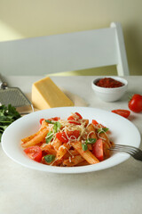 Concept of tasty food with pasta with tomato sauce and ingredients