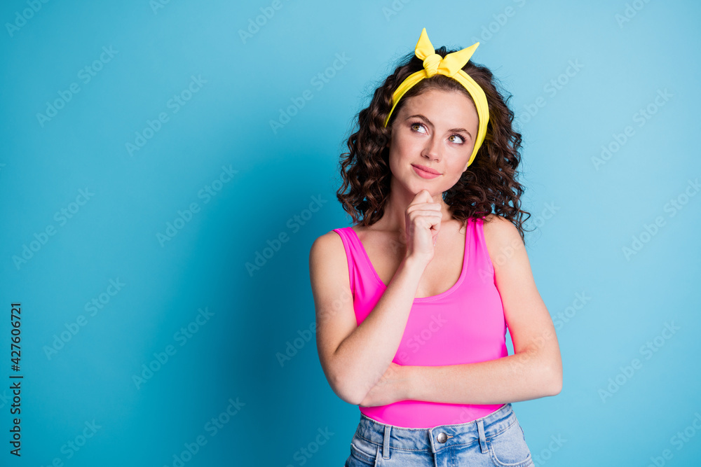 Poster Photo of minded attractive girl hold hand chin look empty space inspiration idea isolated on blue color background