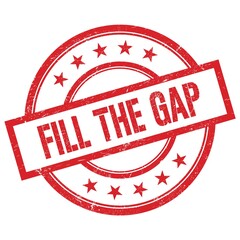 FILL THE GAP text written on red vintage round stamp.