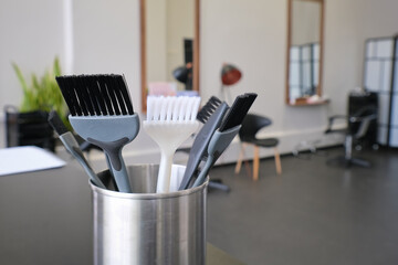 Hair dye brushes in a hairdressing salon. Hair coloring tools set. Professional instrument for hair...