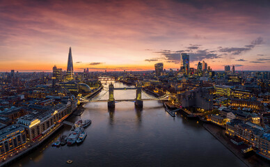 Panoramic aerial view to the illuminated skyline of London, United Kingdom, during a colorful...