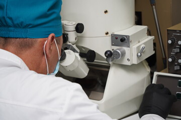Almaty, Kazakhstan - 04.08.2021 : The virologist performs the analysis on special equipment in the laboratory.