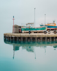 Fototapeta na wymiar Old rusty boats sitting in the dock