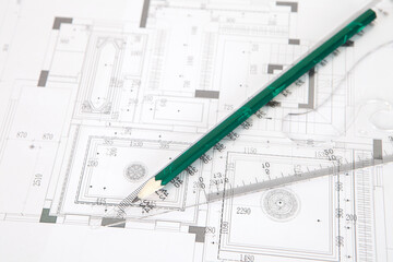 Rulers and pencils on construction drawings