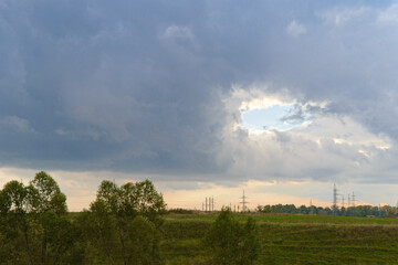 Landscape with a hole in the sky covered with clouds
