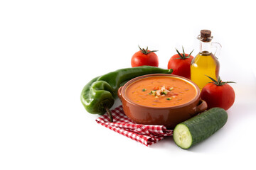 Gazpacho soup in crock pot and ingredients isolated on white background. Copy space