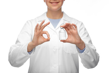 medicine, vaccination and healthcare concept - close up of happy smiling female doctor or nurse with drug in bottle showing ok gesture over white background