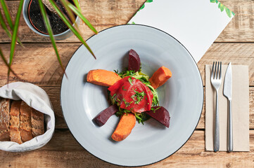 From above Ready to eat Zucchini Spaghetti with Pistachio Pesto and Roasted Sweet Potato