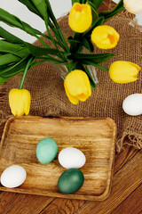 Yellow tulips spring holiday painted eggs Easter