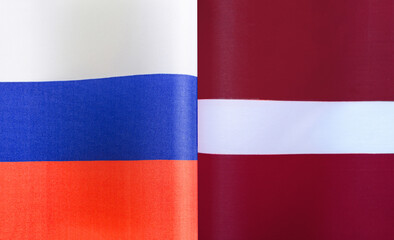 fragments of the national flags of Russia and Latvia close-up