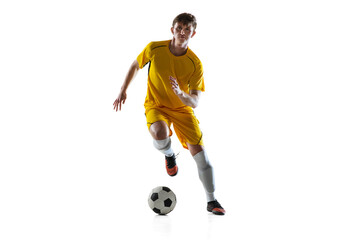 Young man, male soccer football player training isolated on white background.