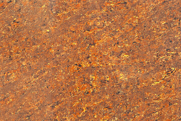 Texture of yellow and orange marble. Stone tile with natural pattern. Marble pavement closeup.