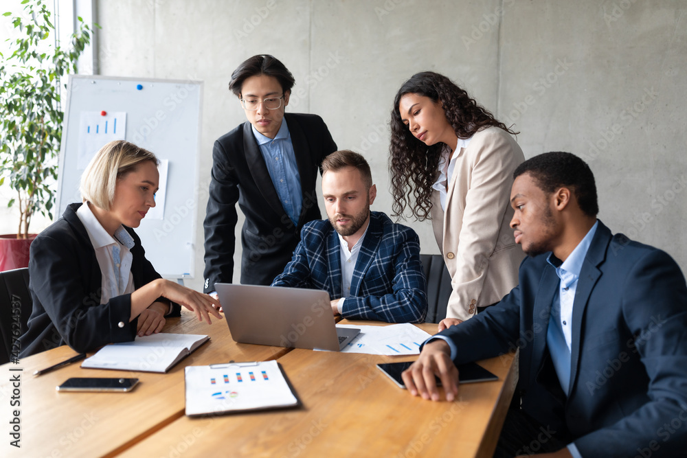 Wall mural Group Of Multiethnic Business People Working On Laptop In Office