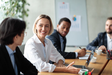 Successful Businesswoman On Corporate Meeting Smiling To Asian Businessman Indoor