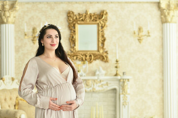 Fototapeta premium Beautiful pregnant woman posing