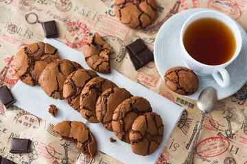 Homemade chocolate cookies brookies, dark chocolate slices and a cup of tea 