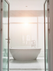 White ceramic round shape bathtub in luxury style master bathroom, interior design for classic elegance home decoration.