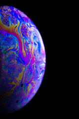 Vibrant universe. Abstract galaxy background with globe planet earth in universe space with sunlight on dark background. Macro of oil mixed with water.