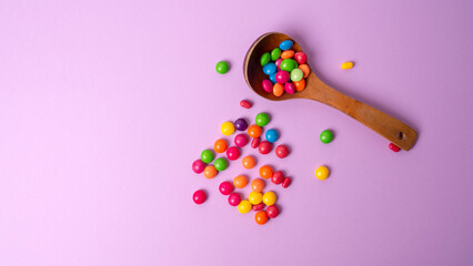 multicolored candy set with a wooden spoon