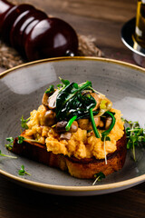 Breakfast omelette with champignon on wooden background
