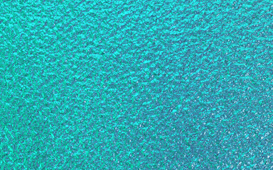 Teal green blue foil paper texture background.