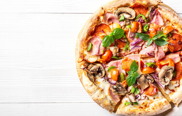 Fresh pizza with bacon, mushrooms, pepperoni lies on a white wooden background, horizontal orientation, flat lay