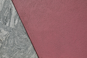 Fototapeta premium red wall divided with marble stone, abstract background with space for text, no person