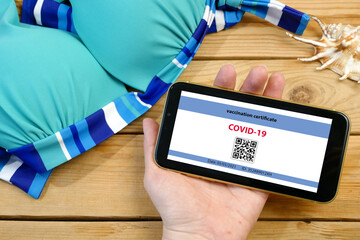 Vaccination passport on a mobile phone allowing travel in hand. Vaccination against the coronavirus Covid 19.Imunity or Health passport