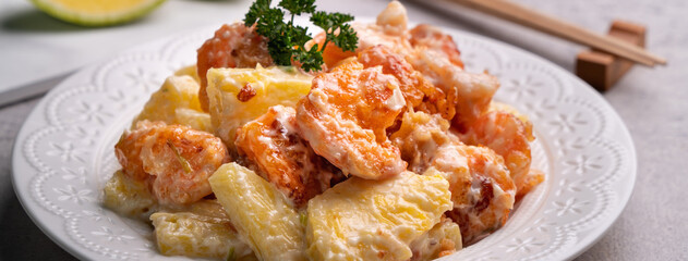 Close up of delicious fried shrimp balls with pineapple and mayonnaise sauce.