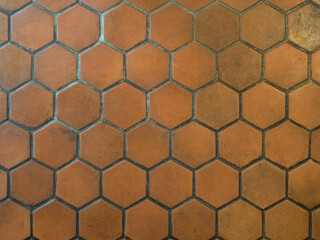Closeup image of old hexagonal clay tiles background. Vintage floor tiles pattern.