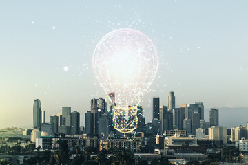 Abstract virtual light bulb illustration on Los Angeles cityscape background, future technology concept. Multiexposure